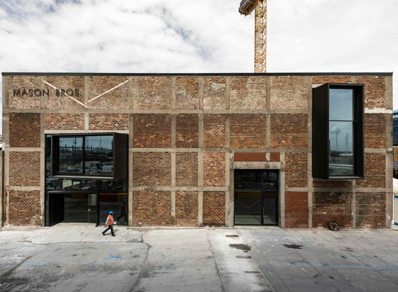 the architects have punctuated the existing brick + concrete fabric