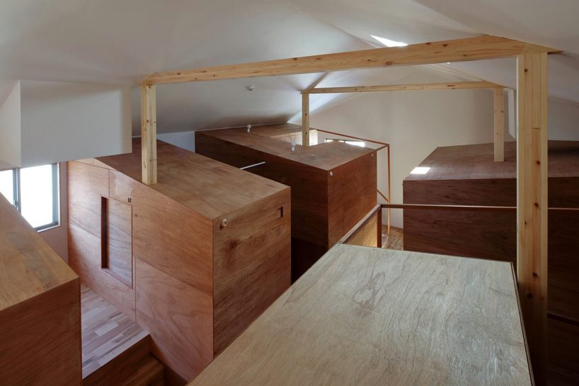  alphaville designs capsule hostel 'sui' in kyoto as cluster of wooden volumes