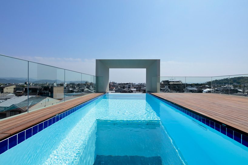 EASTERN design office stacks concrete square tubes for house in kyoto