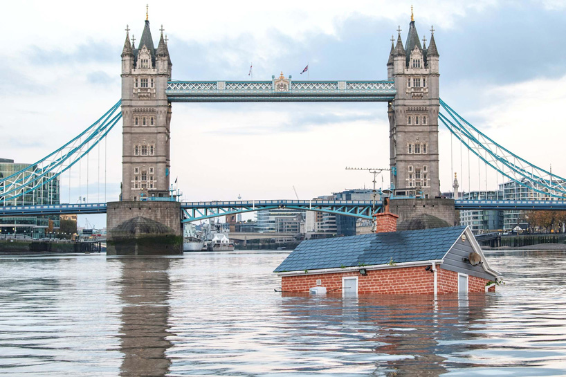 extinction rebellion drops 'sinking house' in the river thames