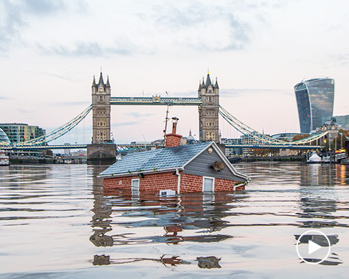 extinction rebellion drops 'sinking house' in the river thames