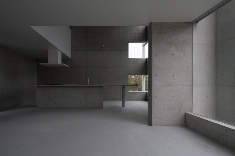 kazunori fujimoto architects completes all-concrete house on a sloping site in ajina, japan