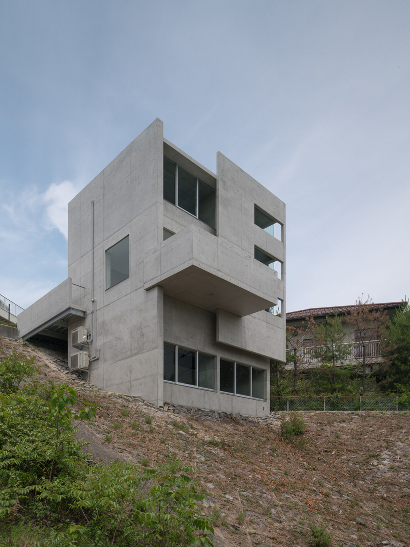 kazunori fujimoto architects completes all-concrete house on a sloping site in ajina, japan