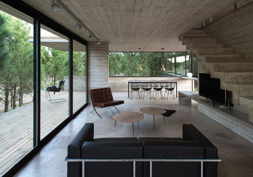 luciano kruk stacks concrete volumes to build a 'house in the trees' in buenos aires designboom
