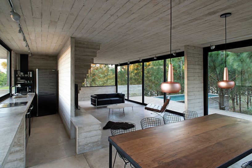 luciano kruk stacks concrete volumes to build a 'house in the trees' in buenos aires designboom