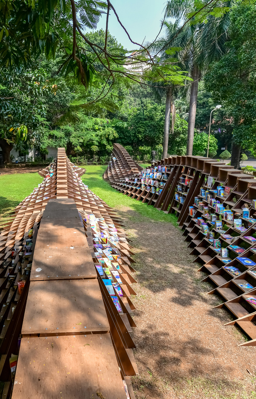 NUDES fabricates the 'bookworm' pavilion to foster a love of reading in india designboom