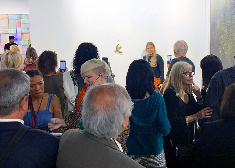 maurizio cattelan's comedian, a duct taped-banana sold for $120.000 at art basel miami