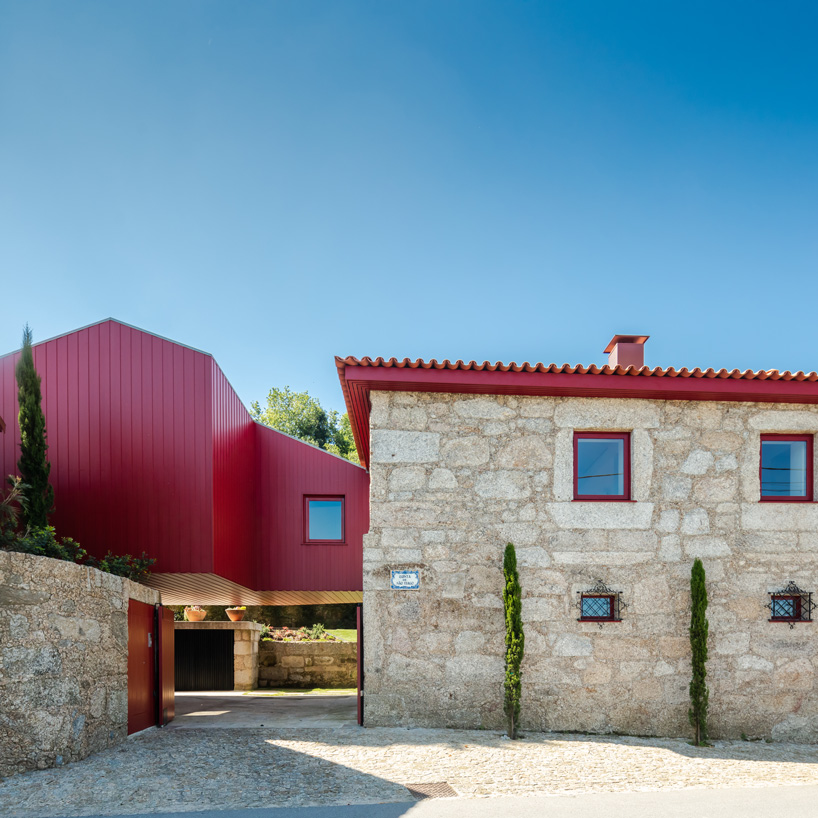 NOARQ adds suspended blood-red cabin to 'q s t' house renovation in portugal