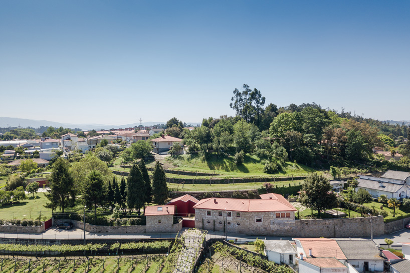 NOARQ adds suspended blood-red cabin to 'q s t' house renovation in portugal