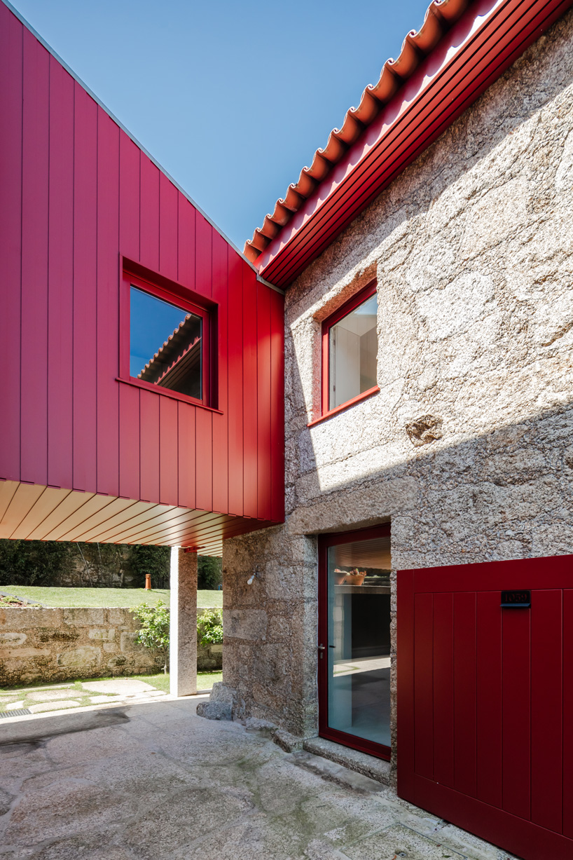NOARQ adds suspended blood-red cabin to 'q s t' house renovation in portugal
