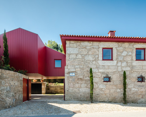 NOARQ adds suspended blood-red cabin to 'q s t' house renovation in portugal