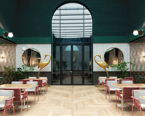 deep green walls adorn the house of millennium restaurant by kissmiklos in budapest