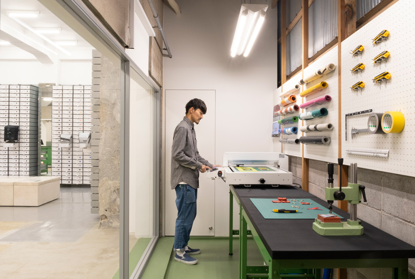 freitag opens store in kyoto, complete with DIY workshop + industrial aesthetics