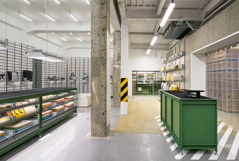  freitag opens store in kyoto, complete with DIY workshop + industrial aesthetics