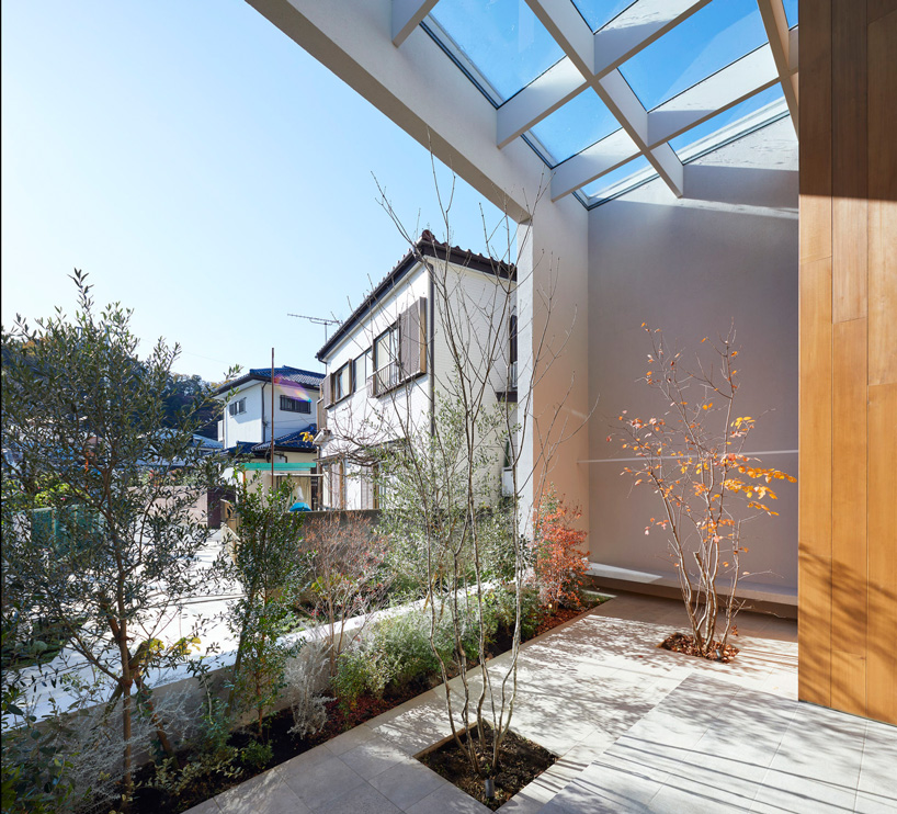 airhouse incorporates nature into this house in takao, japan, via exterior + interior terraces