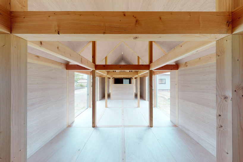 motoki ishikawa architect and associates constructs 50-meter-long wooden house in japan