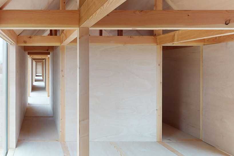 motoki ishikawa architect and associates constructs 50-meter-long wooden house in japan - 1