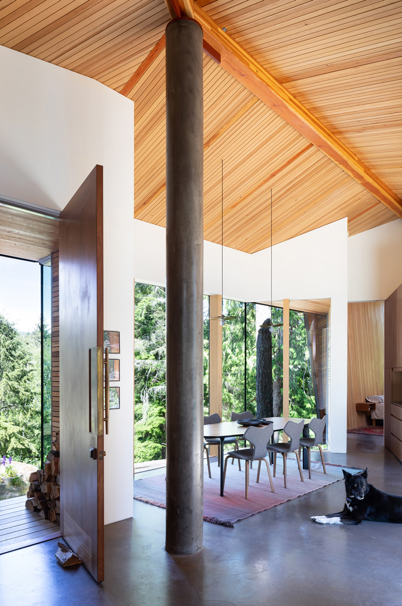  campos studio embeds the sooke house within the forest of a rocky hill in canada