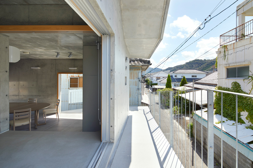 takao shiotsuka atelier connects the floors of SJ building in japan via outdoor concrete ramp