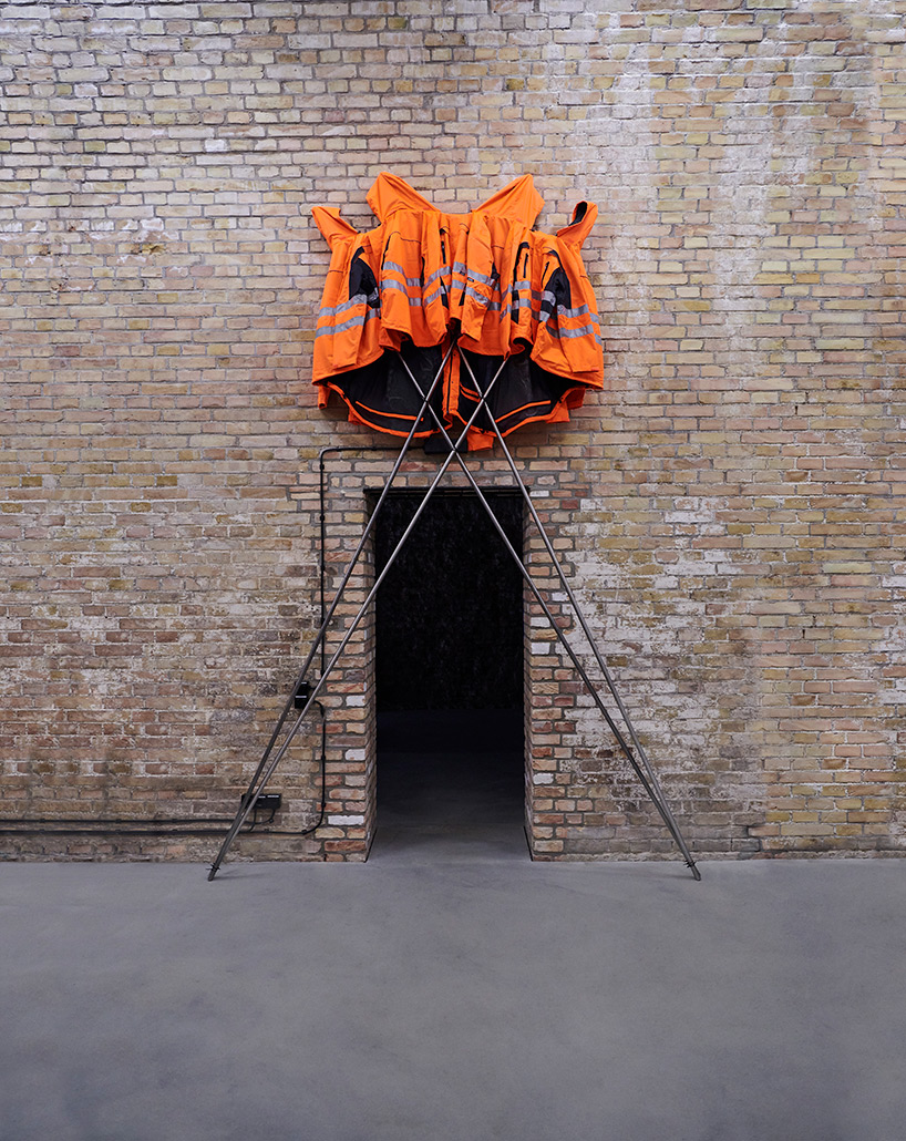 ai weiwei makes DIY sculpture with HORNBACH: safety jackets zipped the other way - 3