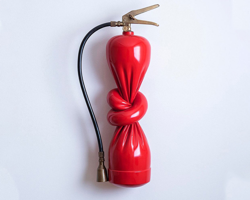 alex chinneck ties a knot in twisted fire extinguisher sculpture