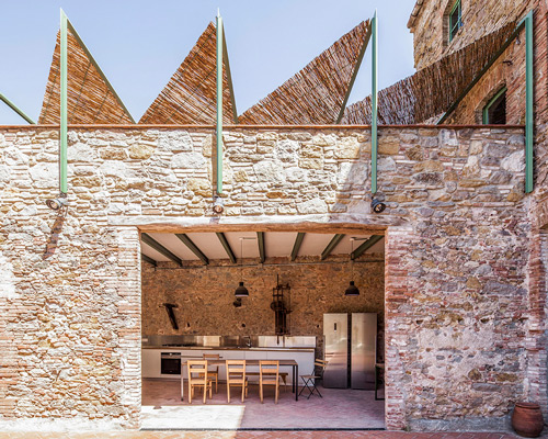 anna & eugeni bach transform former chocolate factory in spain into a warm, luminous oasis