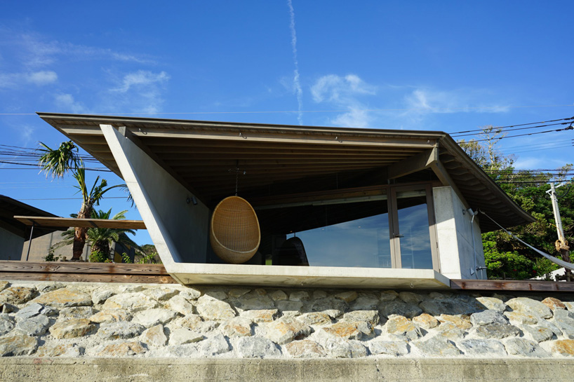 atelier tekuto + amami design firm build beachfront origami-like concrete villas in japan