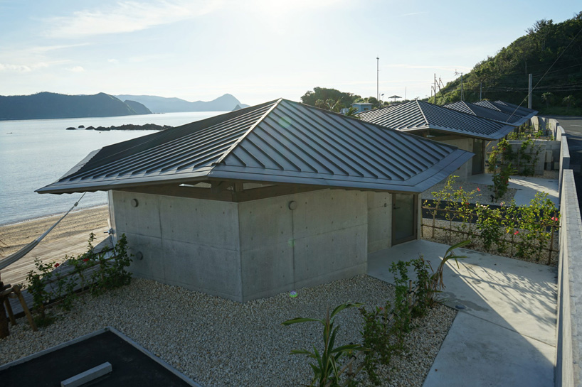 atelier tekuto + amami design firm build beachfront origami-like concrete villas in japan