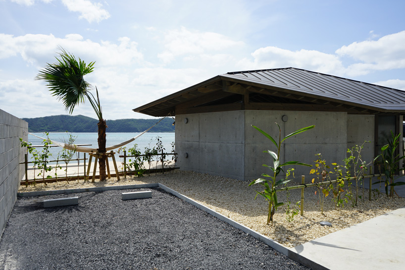 atelier tekuto + amami design firm build beachfront origami-like concrete villas in japan
