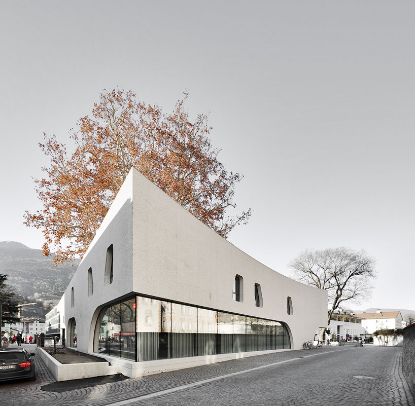 curving concrete wraps modus architects' 'treehugger' tourist office in italy designboom
