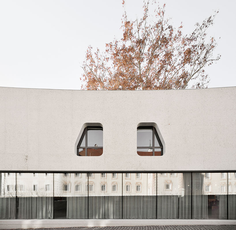 curving concrete wraps modus architects' 'treehugger' tourist office in italy designboom