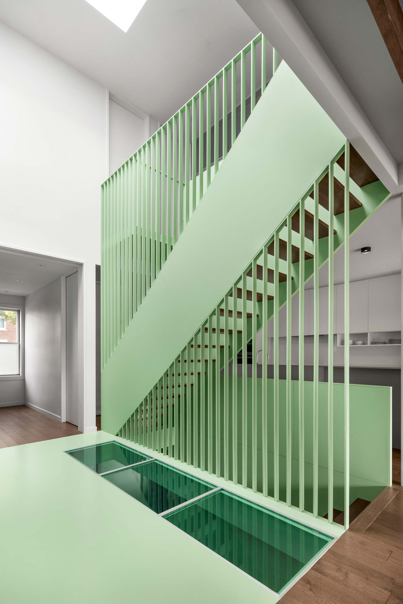 sage green staircase takes center stage in montreal residence renovation by naturehumaine