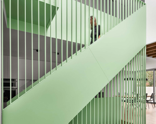 sage green staircase takes center stage in montreal residence renovation by naturehumaine