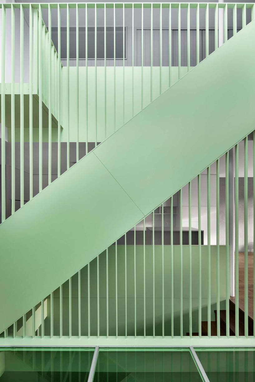 sage green staircase takes center stage in montreal residence renovation by naturehumaine