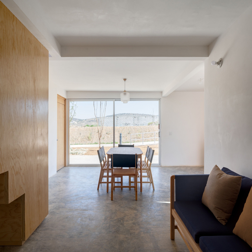 two pink adobe volumes form PPAA's prototype for social housing project in mexico designboom