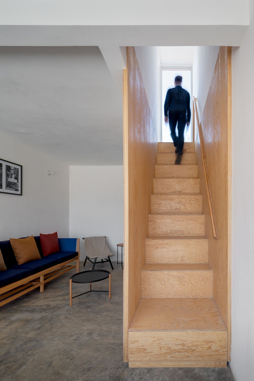 two pink adobe volumes form PPAA's prototype for social housing project in mexico designboom
