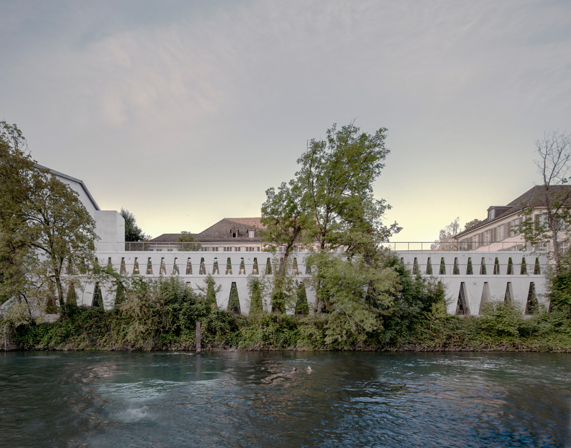 barozzi veiga clads tanzhaus zürich in façade of repetitive triangular openings