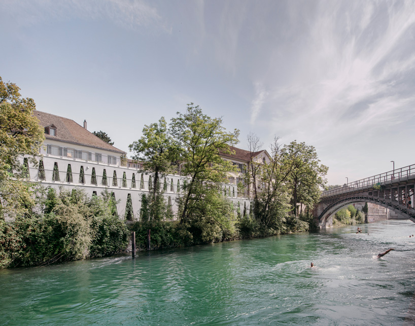 barozzi veiga clads tanzhaus zürich in façade of repetitive triangular openings