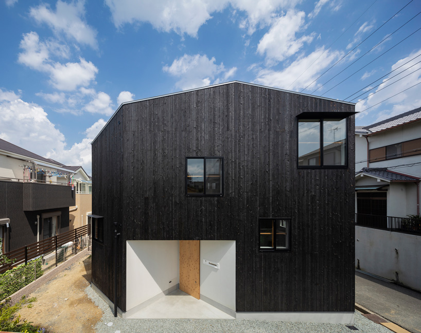 tato architects wraps house in takatsuki, japan, in charred wood exterior