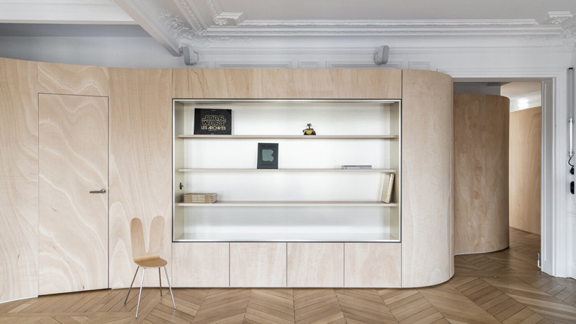toledano + architects adds curved wooden 'ribbon' to haussmanian apartment in paris