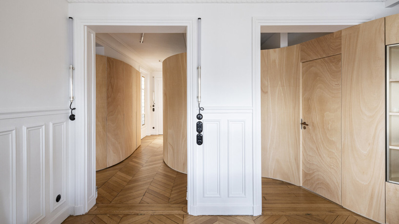 toledano + architects adds curved wooden 'ribbon' to haussmanian apartment in paris