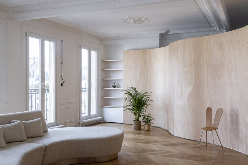 toledano + architects adds curved wooden 'ribbon' to haussmanian apartment in paris