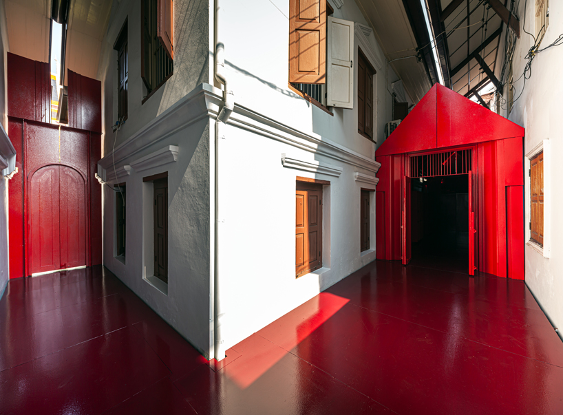 walllasia builds a tiny red museum into bangkok's royal monastery designboom