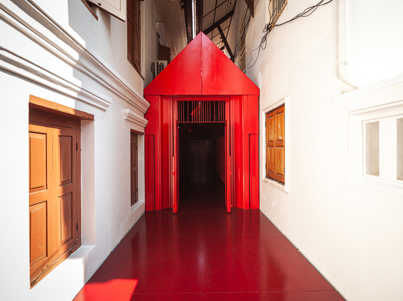 walllasia builds a tiny red museum into bangkok's royal monastery designboom