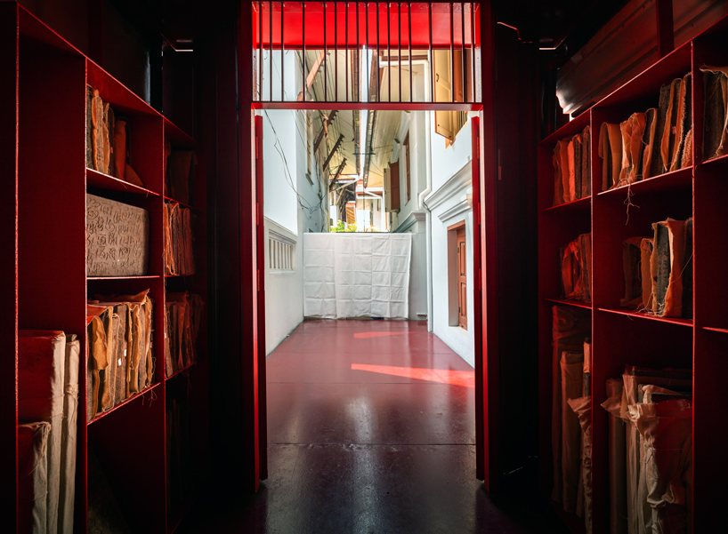 walllasia builds a tiny red museum into bangkok's royal monastery designboom