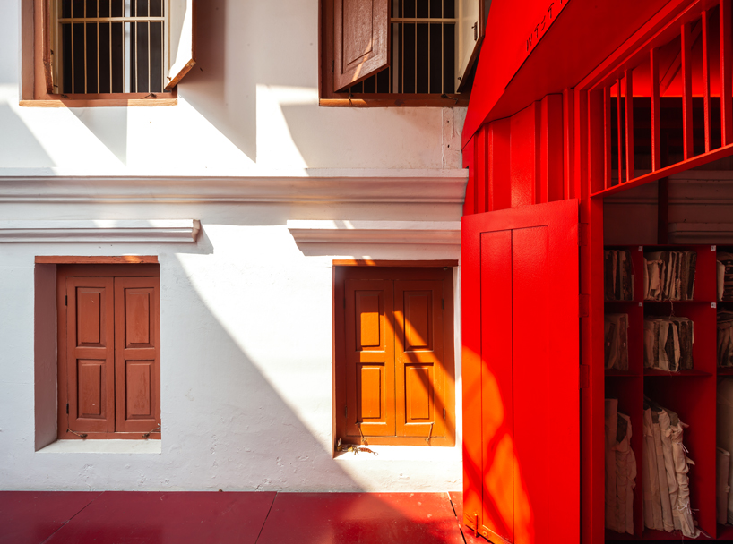 walllasia builds a tiny red museum into bangkok's royal monastery designboom