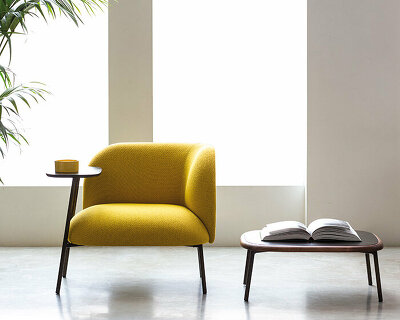 bross' expanded lounge system pairs woodwork with enveloping upholstery