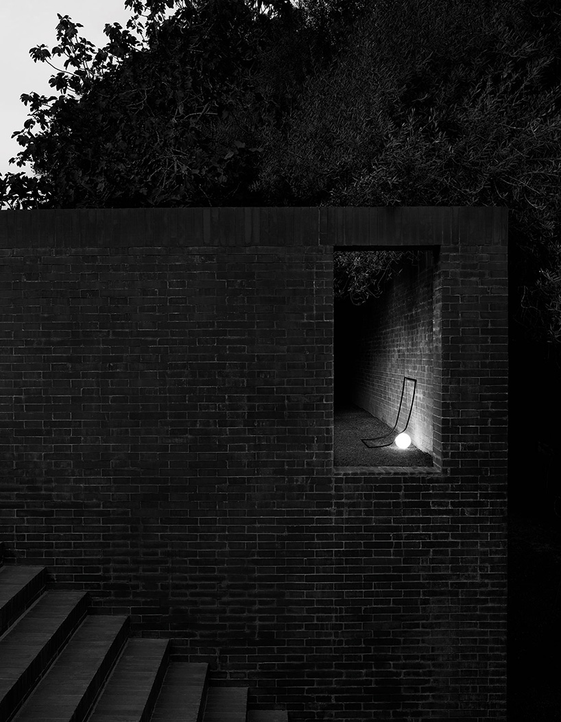 nendo combines an opalescent glass sphere with a metal structure in heco for flos