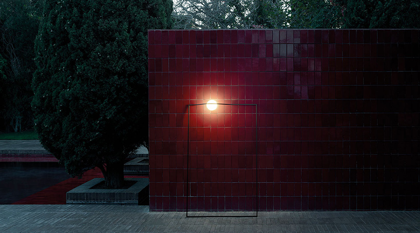 nendo combines an opalescent glass sphere with a metal structure in heco for flos