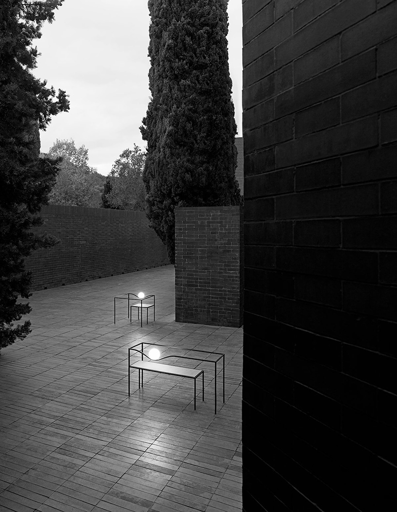 nendo combines an opalescent glass sphere with a metal structure in heco for flos